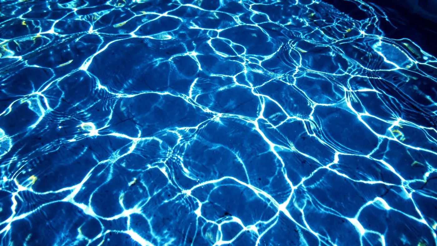 Sunlit pool water with rippling light patterns